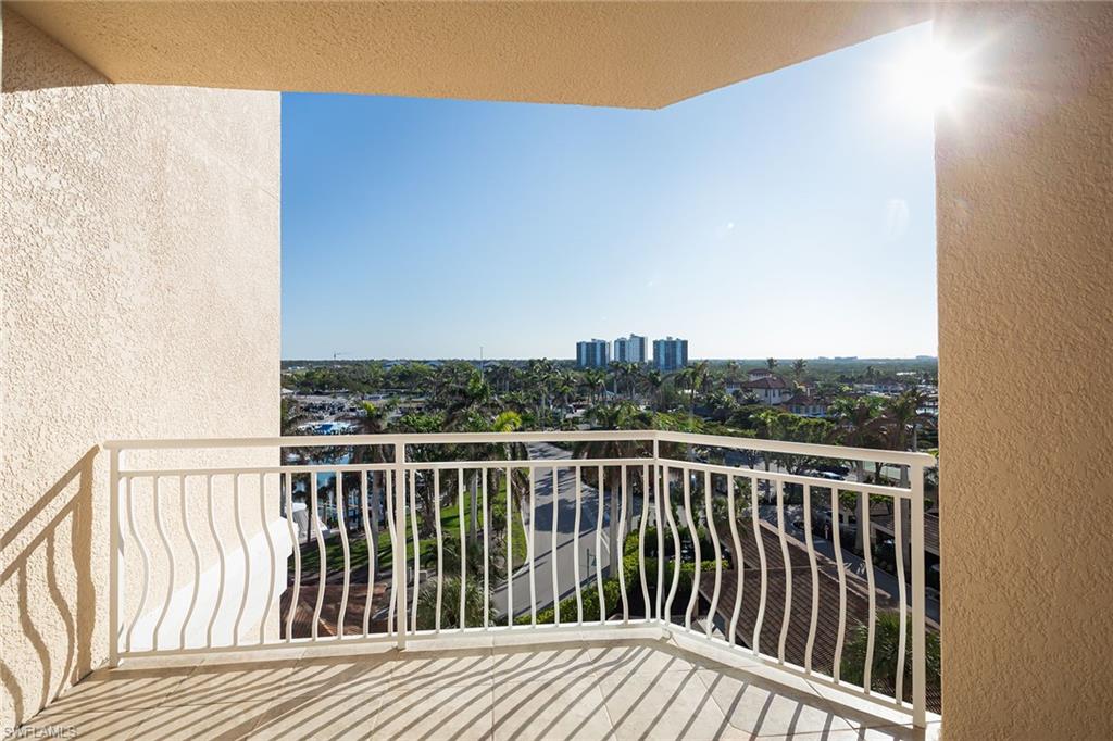 435 Dockside Drive, Unit B703 Naples, FL 34110 - Photo 16 of 38 a view of a balcony with wooden floor