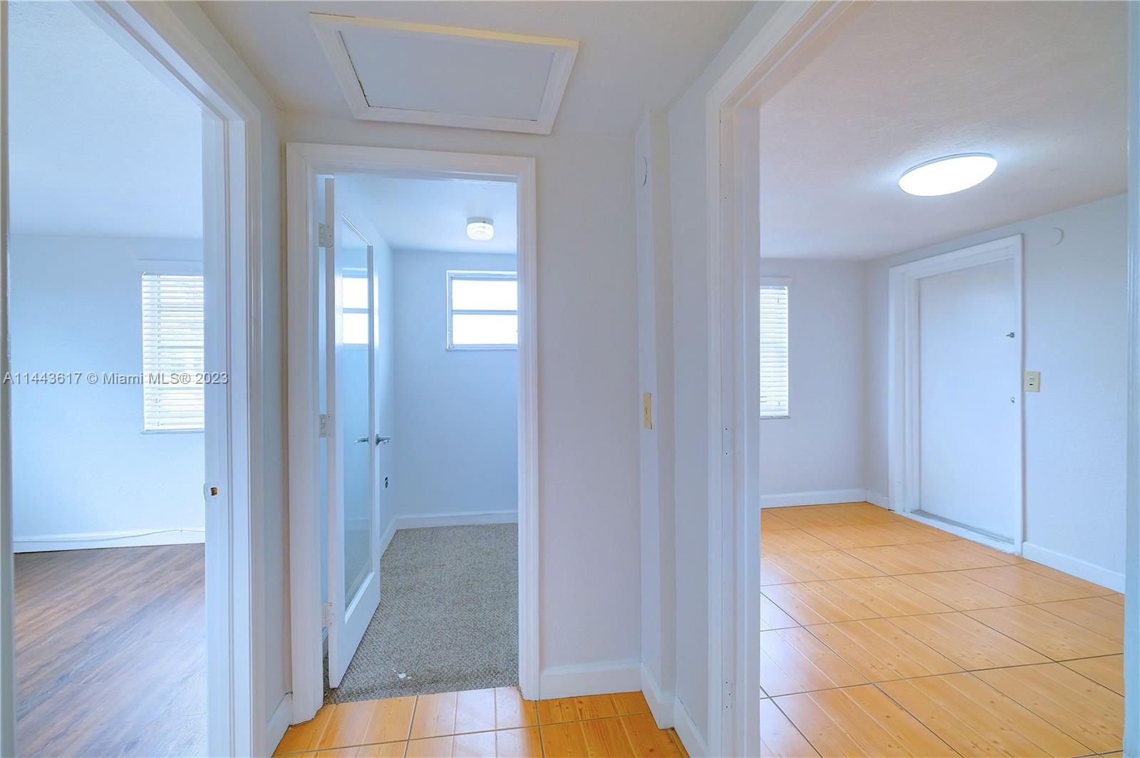 4640 Northwest 7th Street, Unit TOP Miami, FL 33126 - Photo 12 of 23 a view of hallway with wooden floor