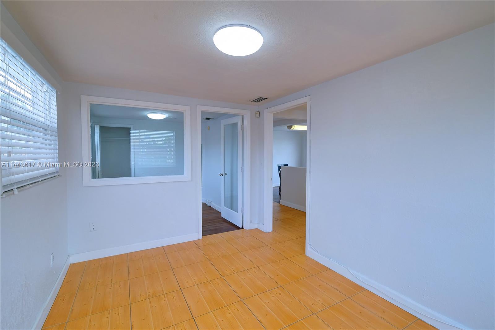 4640 Northwest 7th Street, Unit TOP Miami, FL 33126 - Photo 3 of 23 a view of a room with wooden floor and staircase