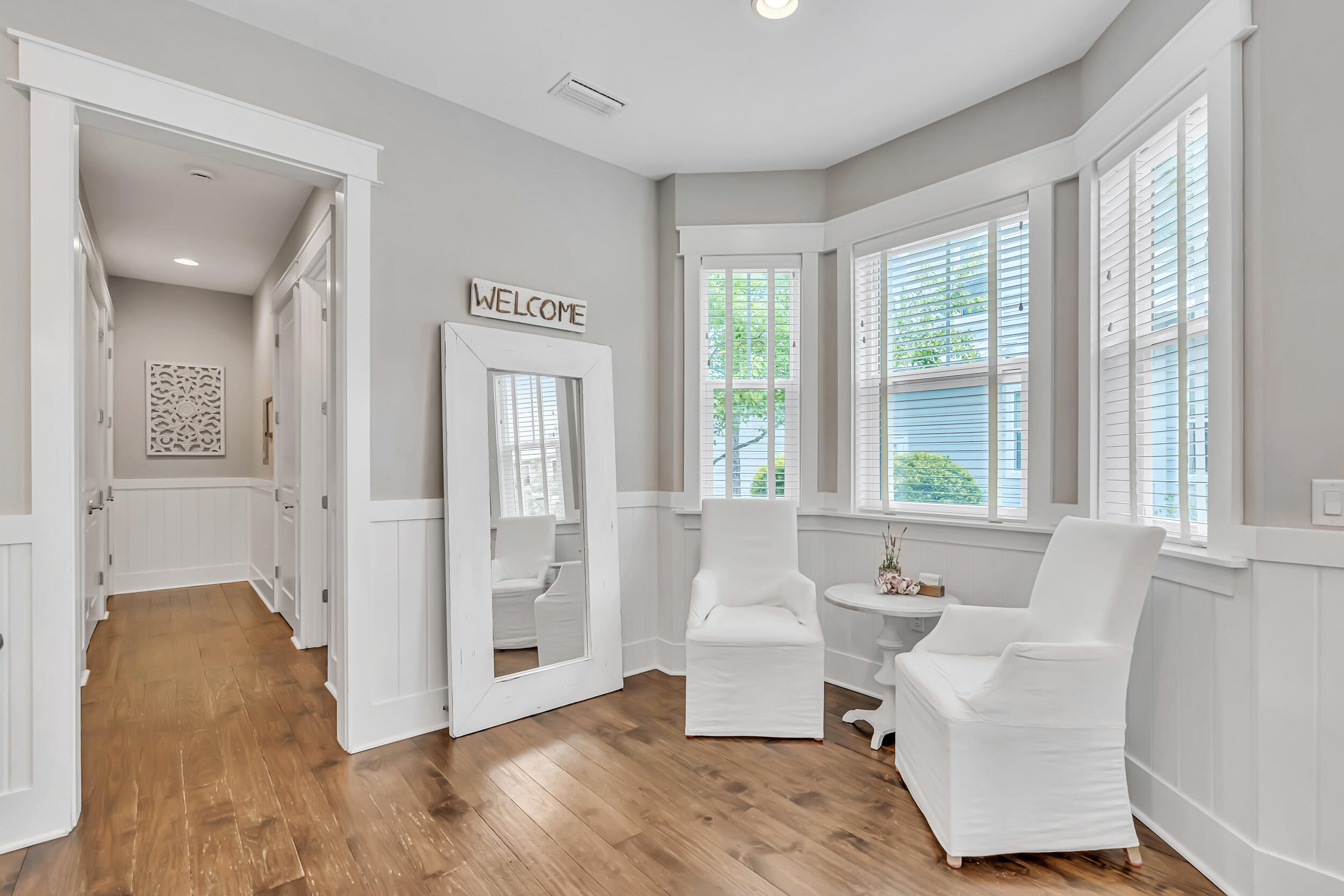 679 Flatwoods Forest Loop Santa Rosa Beach, FL 32459 - Photo 14 of 46 a living room with furniture and large windows