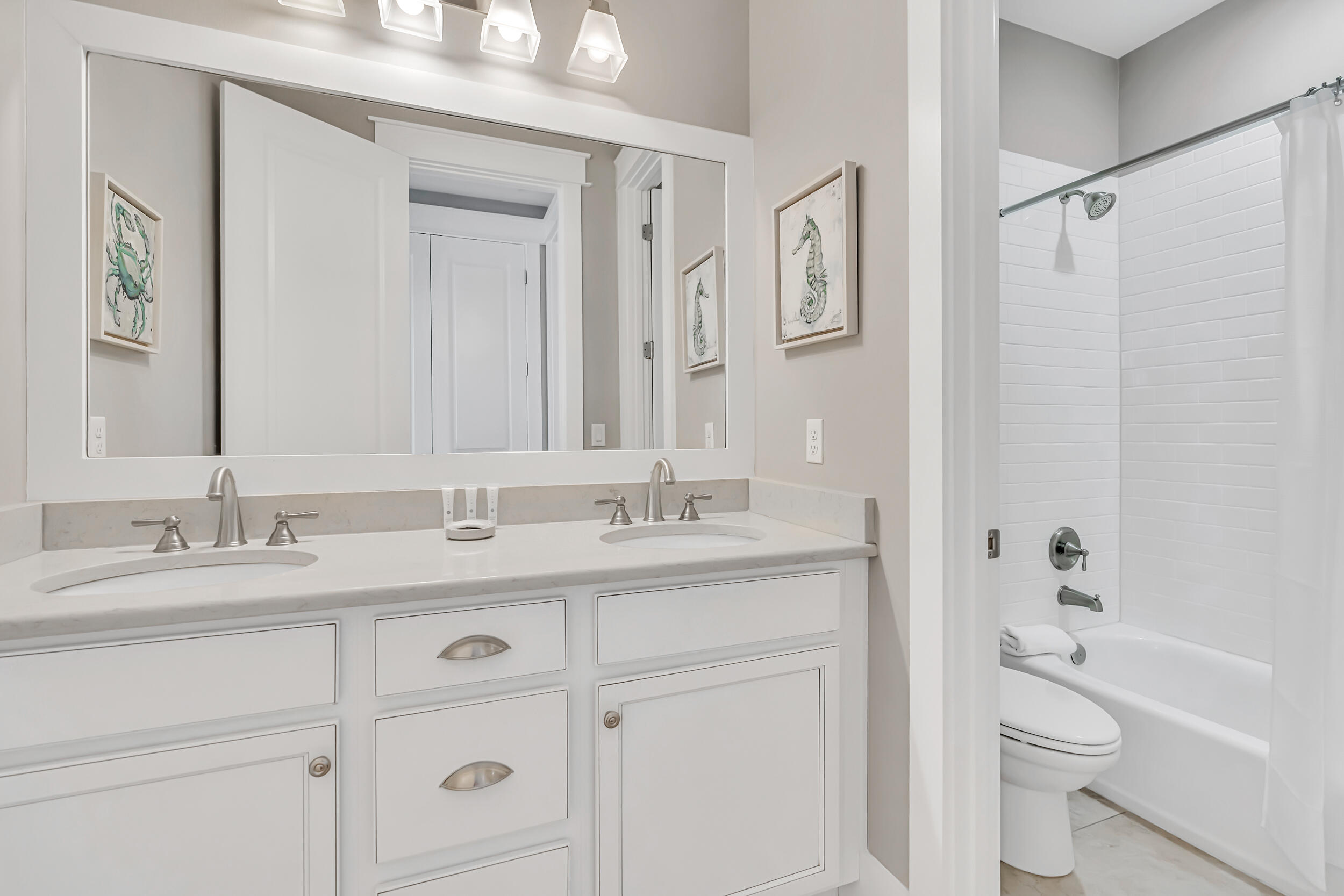 679 Flatwoods Forest Loop Santa Rosa Beach, FL 32459 - Photo 29 of 46 a bathroom with a granite countertop sink a toilet and a bathtub