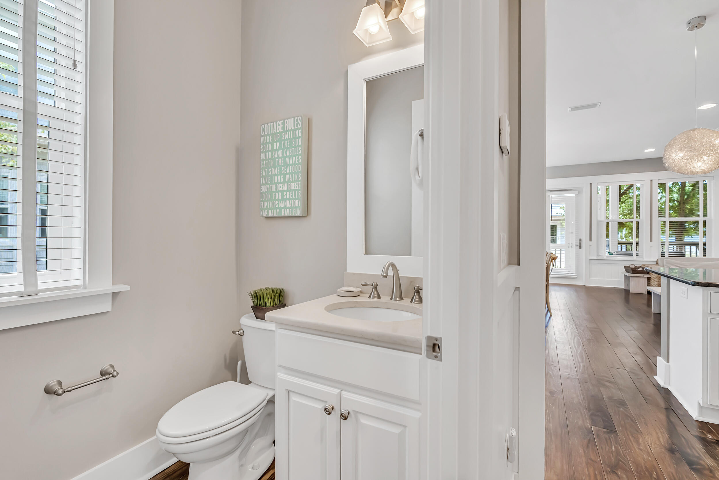679 Flatwoods Forest Loop Santa Rosa Beach, FL 32459 - Photo 33 of 46 a bathroom with a sink toilet and a mirror