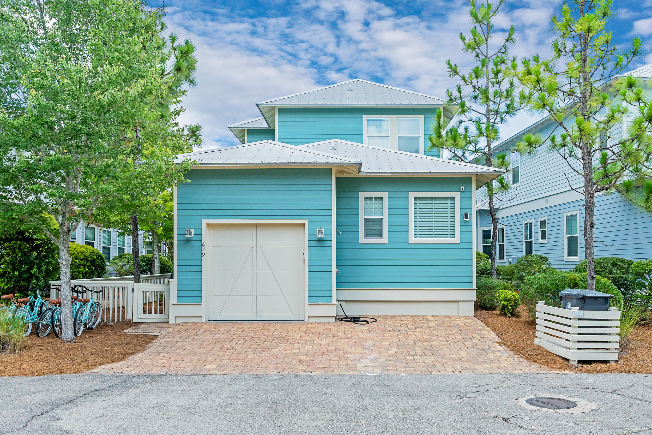 679 Flatwoods Forest Loop Santa Rosa Beach, FL 32459 - Photo 35 of 46 a front view of a house with a garage