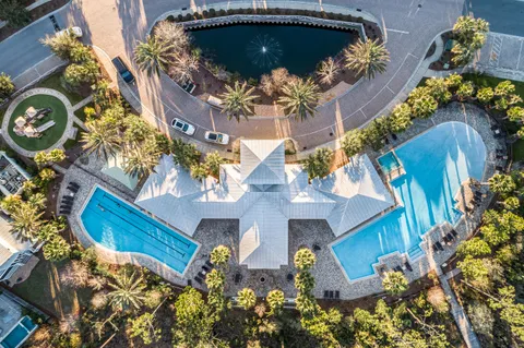 an aerial view of a house with a yard and garden