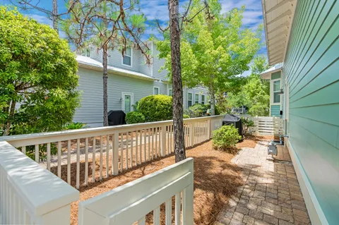 a view of a chair and table in the balcony