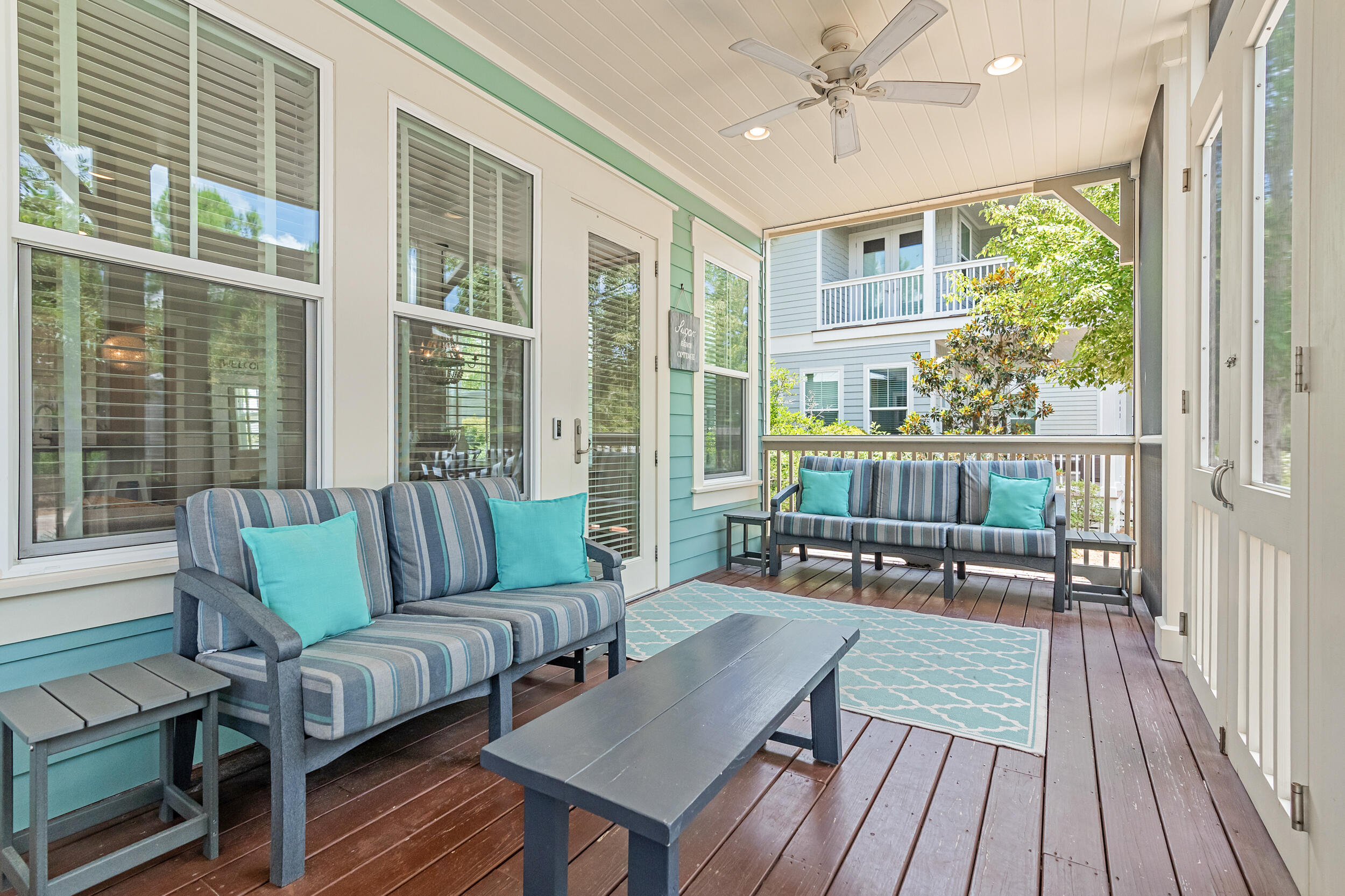 679 Flatwoods Forest Loop Santa Rosa Beach, FL 32459 - Photo 7 of 46 a balcony with furniture and a potted plant