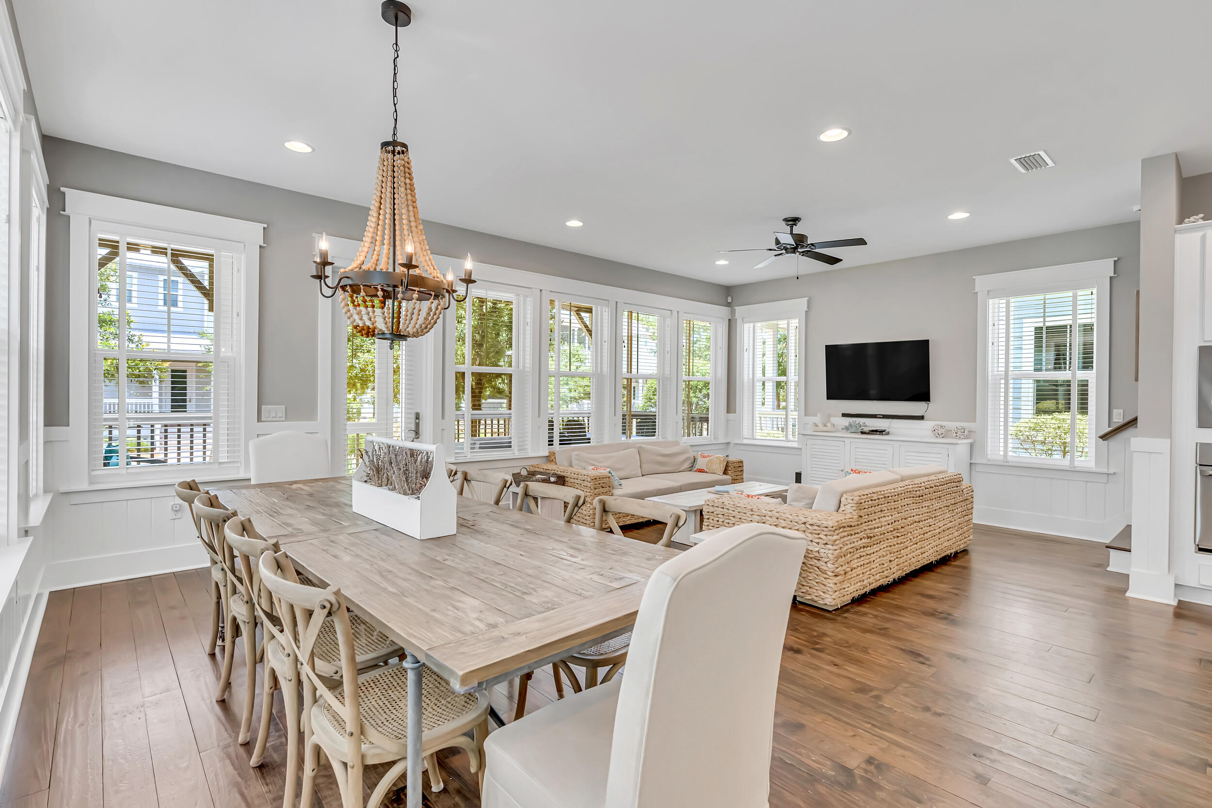 679 Flatwoods Forest Loop Santa Rosa Beach, FL 32459 - Photo 9 of 46 a view of a dining room with furniture window and wooden floor