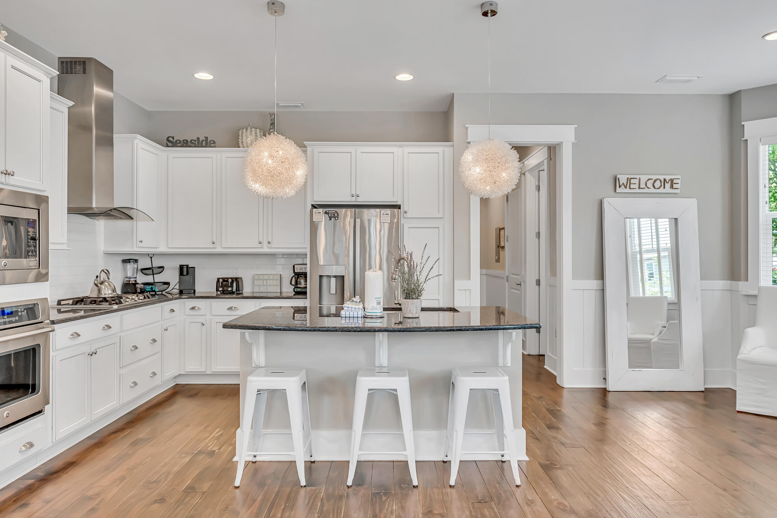 679 Flatwoods Forest Loop Santa Rosa Beach, FL 32459 - Photo 10 of 46 a large kitchen with a table and chairs