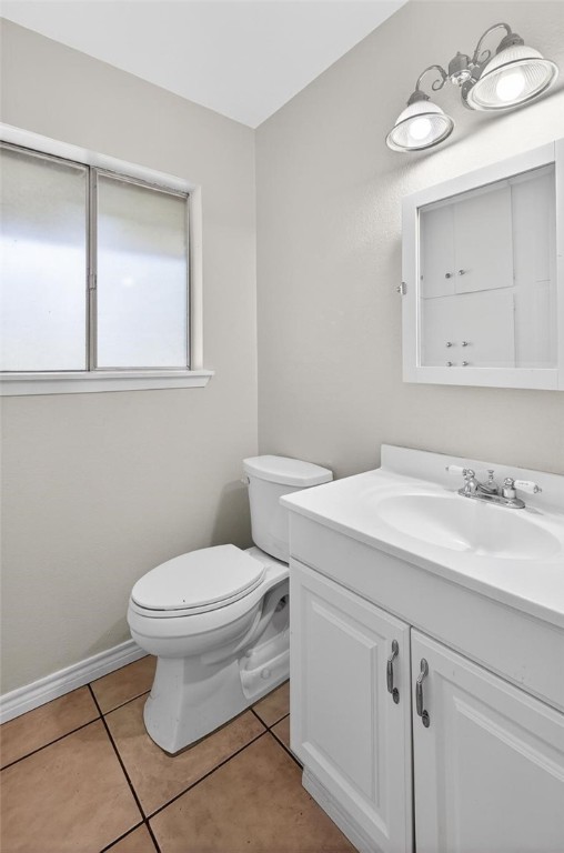 1104 Polaris Drive Portland, TX 78374 - Photo 12 of 39 a bathroom with a toilet sink and mirror