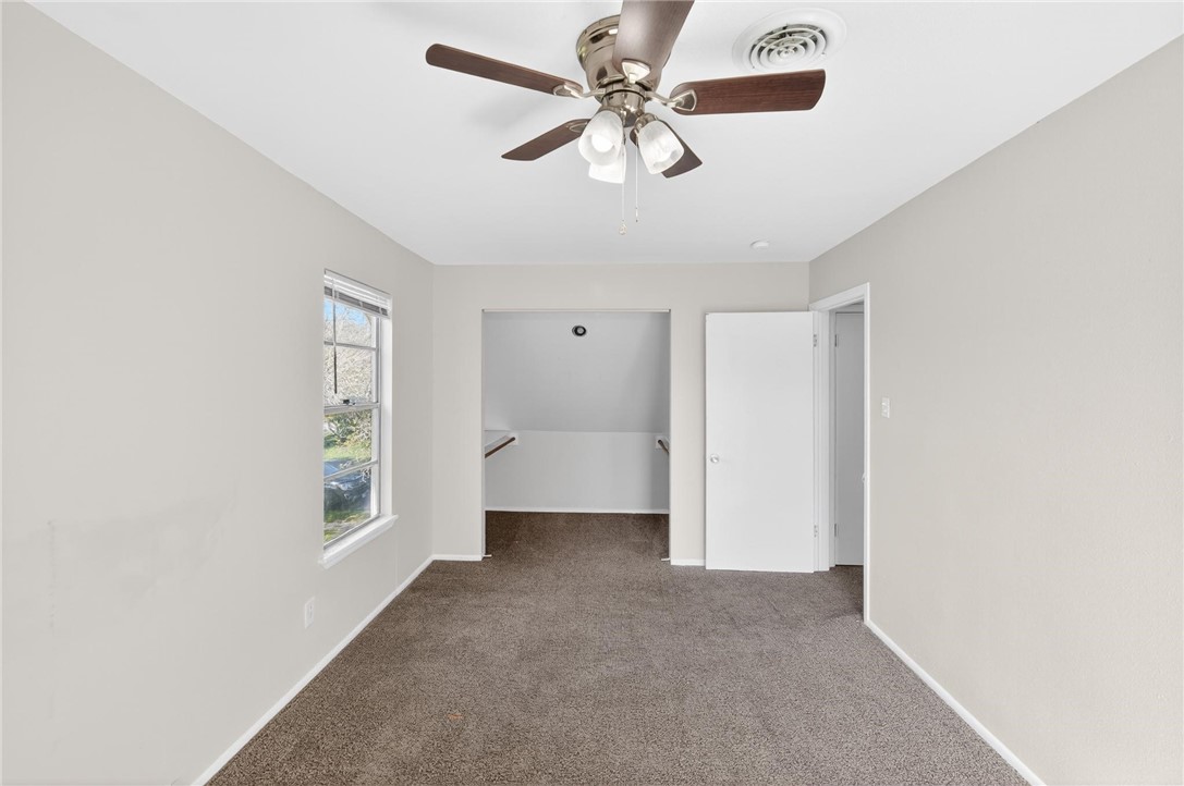 1104 Polaris Drive Portland, TX 78374 - Photo 17 of 39 a view of a livingroom with a ceiling fan and window