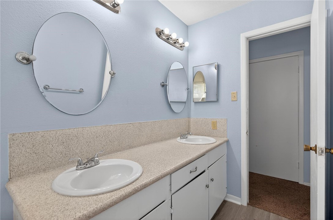 1104 Polaris Drive Portland, TX 78374 - Photo 21 of 39 a bathroom with a sink and a mirror