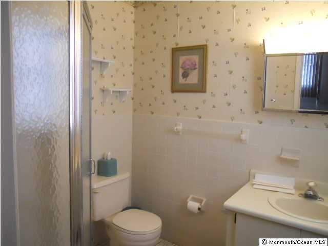 19 Oakfield Road Toms River, NJ 08757 - Photo 11 of 15 a bathroom with a toilet and a sink