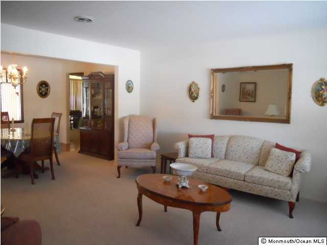 19 Oakfield Road Toms River, NJ 08757 - Photo 2 of 15 a living room with furniture and wooden floor