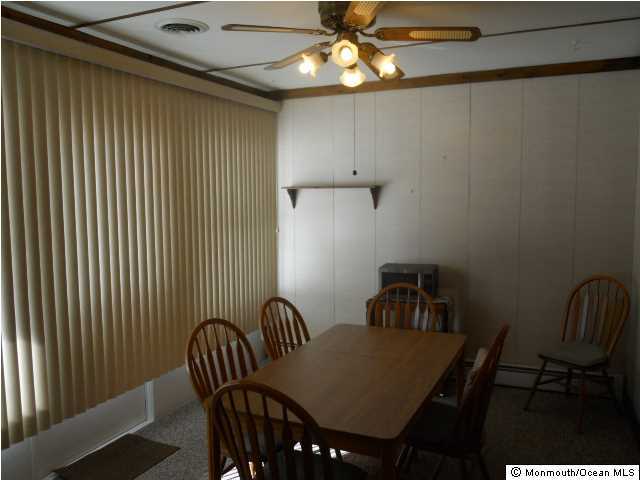 19 Oakfield Road Toms River, NJ 08757 - Photo 7 of 15 a view of a dining room with furniture and chandelier