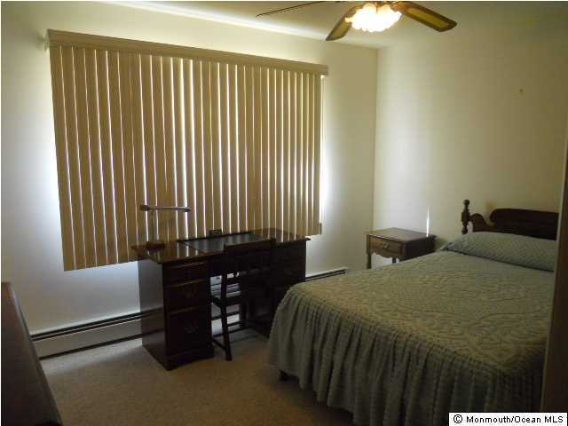 19 Oakfield Road Toms River, NJ 08757 - Photo 8 of 15 a bedroom with a bed and a window