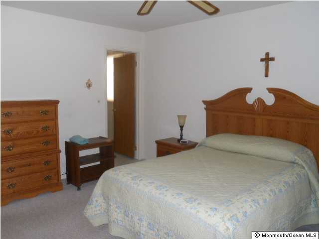 19 Oakfield Road Toms River, NJ 08757 - Photo 10 of 15 a bedroom with a bed and a dresser
