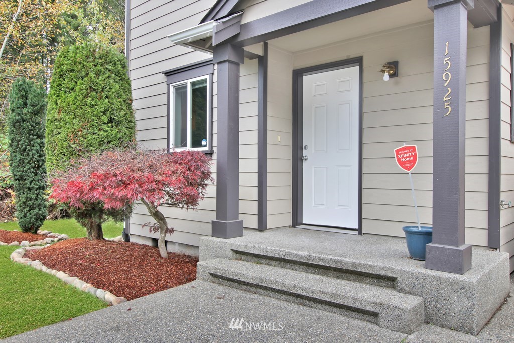 15925 Spanaway Loop Road South Spanaway, WA 98387 - Photo 1 of 14 a front view of a house with entryway