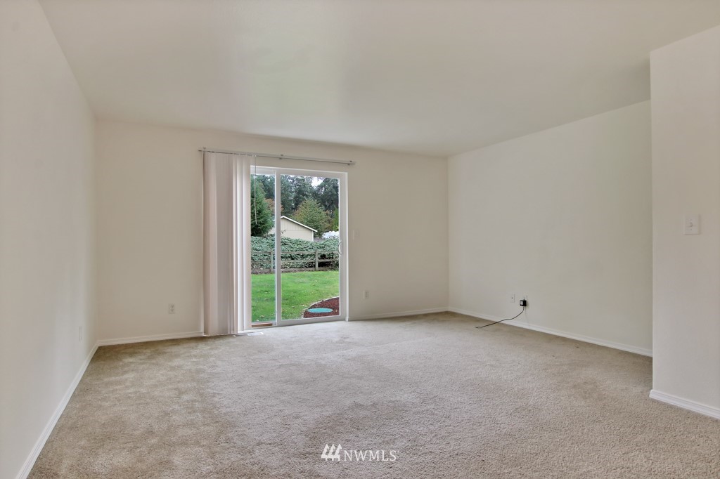 15925 Spanaway Loop Road South Spanaway, WA 98387 - Photo 7 of 14 a view of an empty room with a window