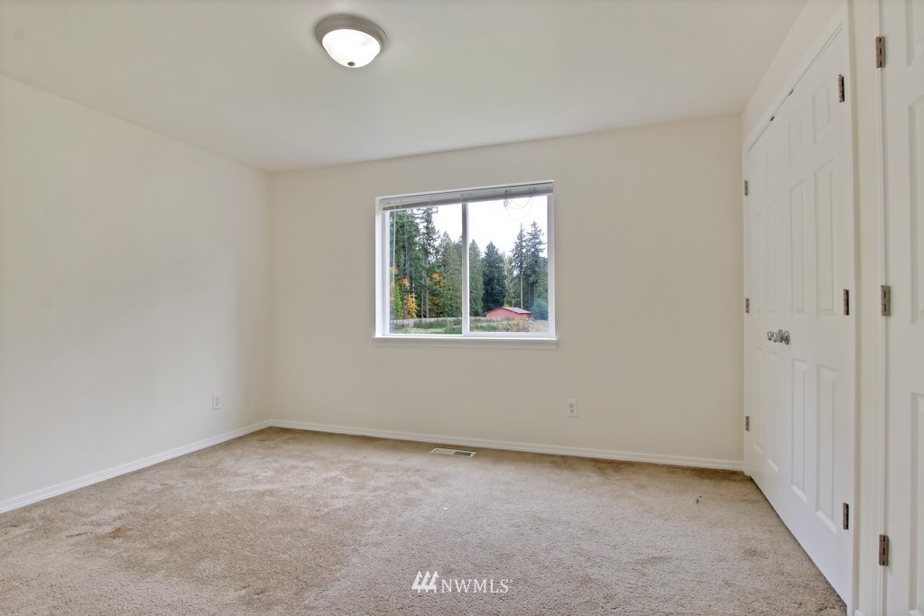 15925 Spanaway Loop Road South Spanaway, WA 98387 - Photo 8 of 14 an empty room with windows