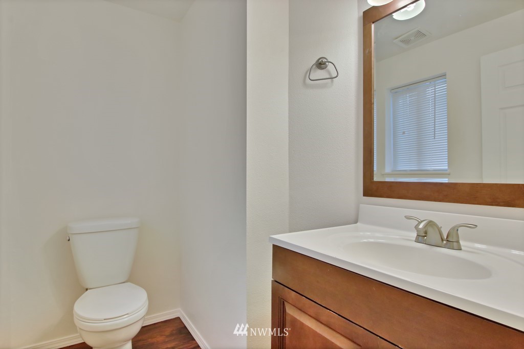 15925 Spanaway Loop Road South Spanaway, WA 98387 - Photo 10 of 14 a bathroom with a toilet sink vanity granite and shower