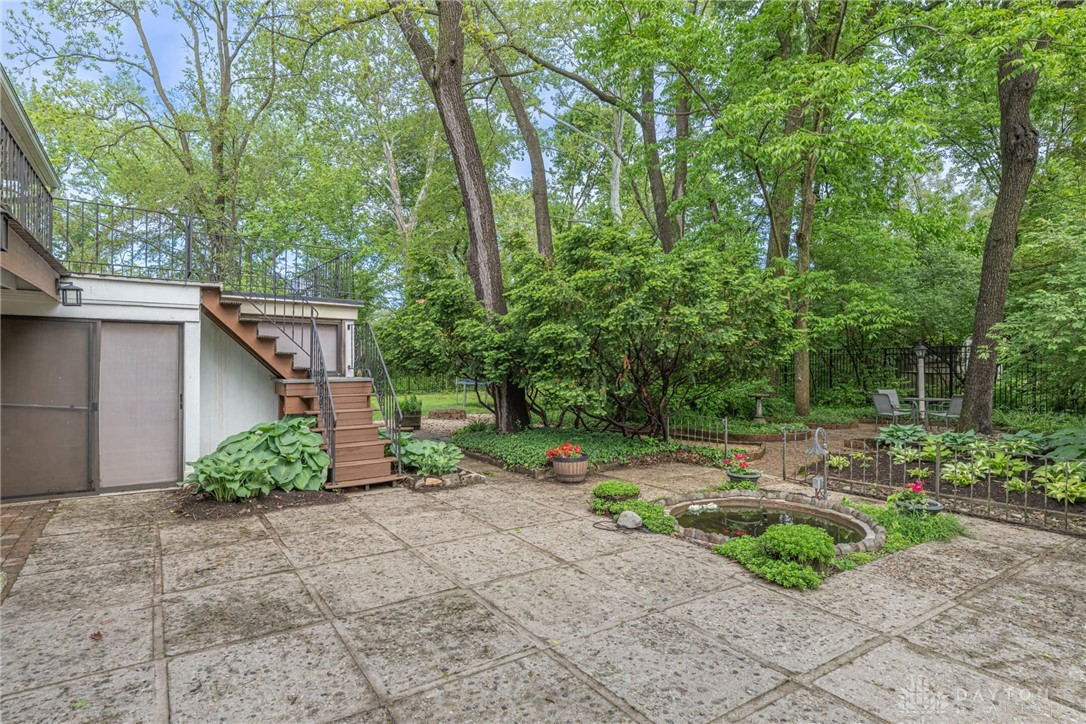 467 West Rahn Road Dayton, OH 45429 - Photo 32 of 41 This verdant retreat features a tranquil pond, perfect for serene outdoor living.