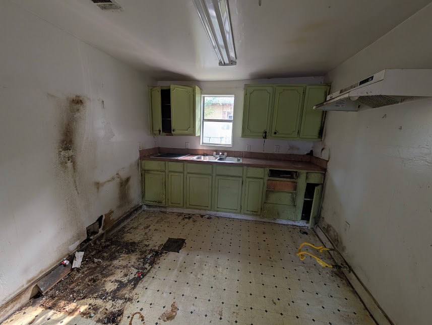 3208 East 16th Street Austin, TX 78721 - Photo 11 of 11 A fixer-upper kitchen awaits a total transformation with ample space for modern upgrades.
