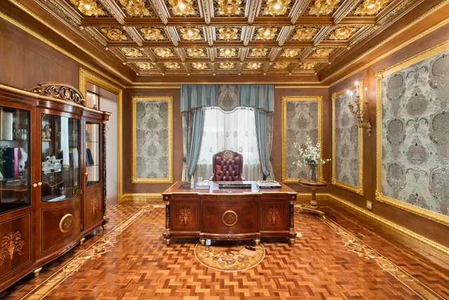a view of a patio with table and chairs potted plants and a palm tree