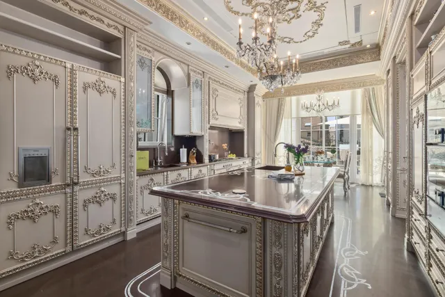 a bedroom with a bed painting on wall and a large window