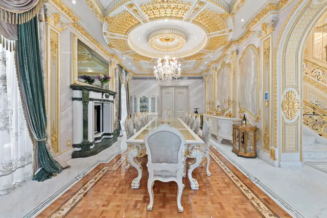 a living room with fireplace furniture and a large window