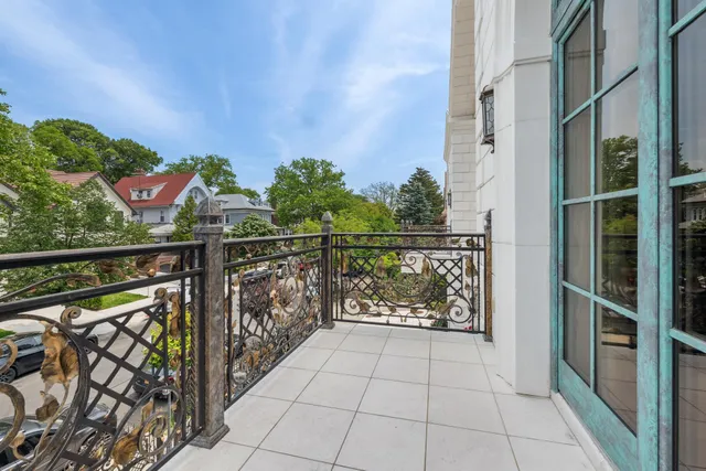 a living room with a large window and a table