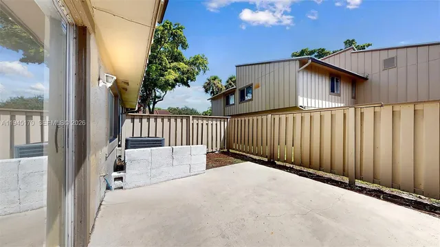 a small garden covered with tall trees