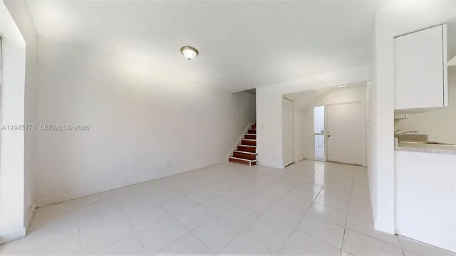 a view of kitchen and hallway with furniture