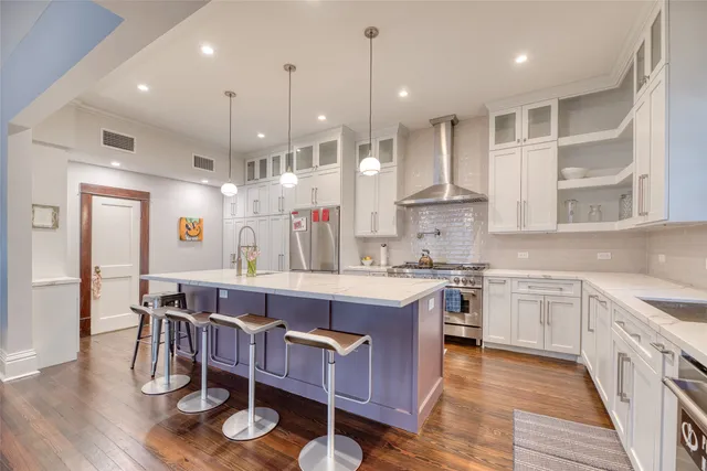 a bedroom with a bed bookshelf and a window