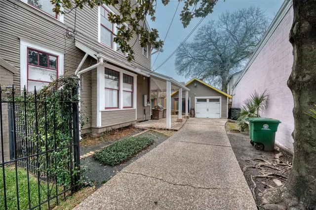 a view of an entryway with wooden floor and staircase