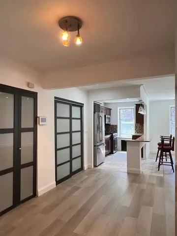 a view of a livingroom with furniture and chandelier