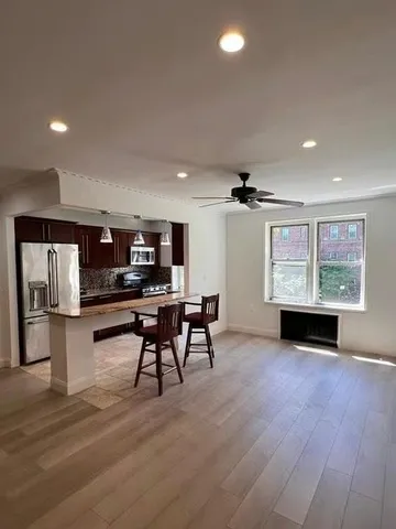 an empty room with furniture and windows