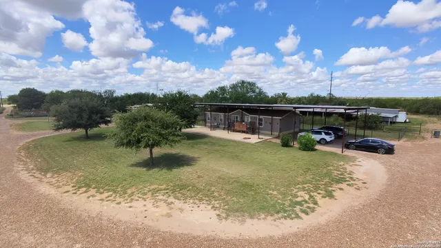 a view of a lake with a yard