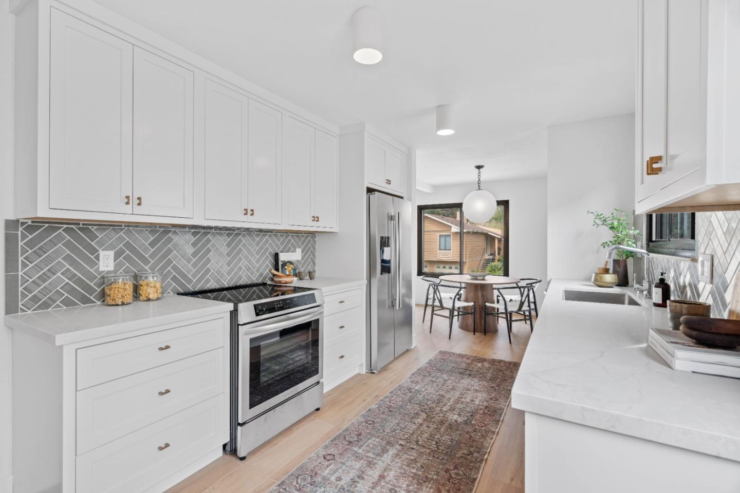 289 Dennis Drive Daly City, CA 94015 - Photo 14 of 45 a kitchen with stainless steel appliances granite countertop a stove and white cabinets
