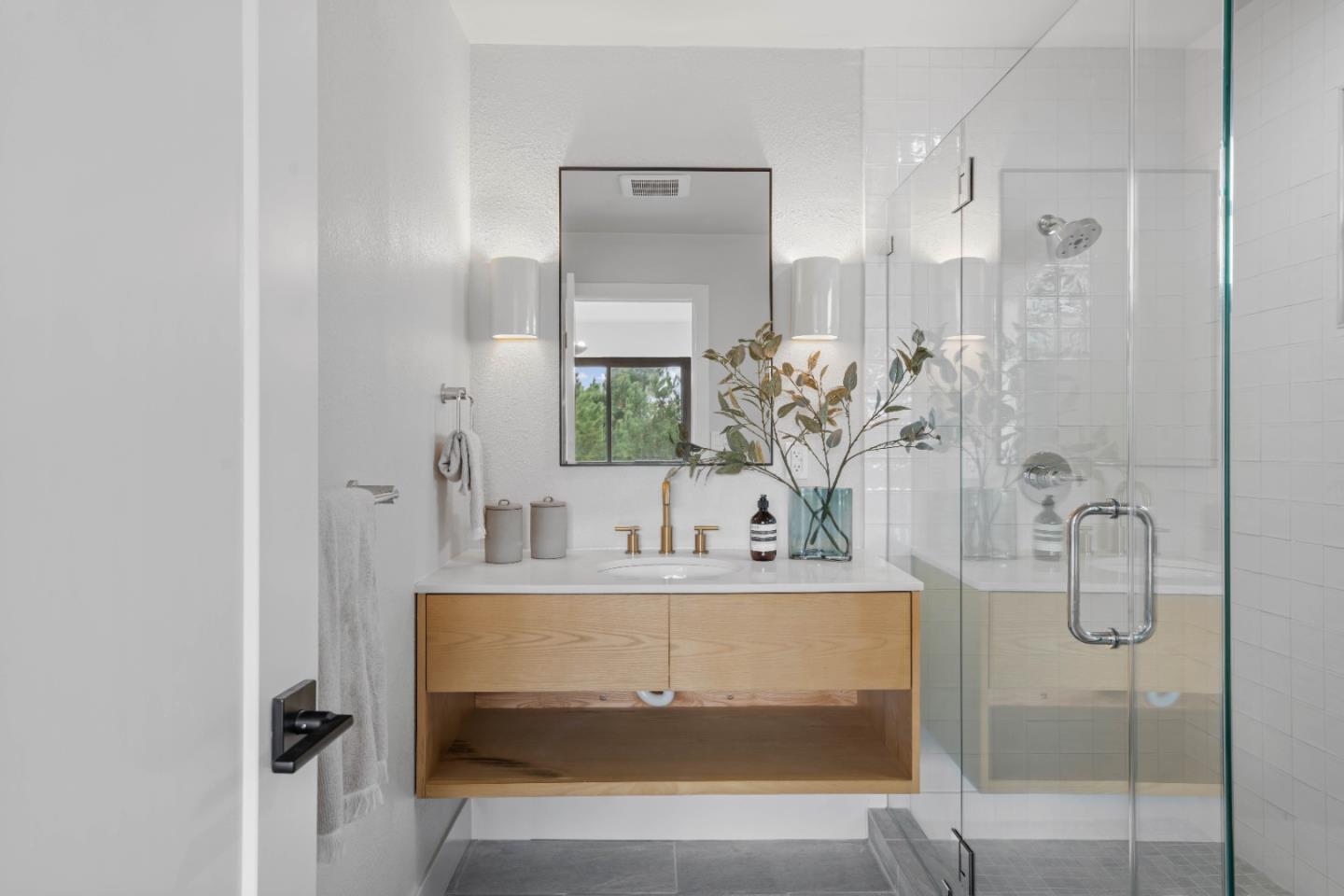 289 Dennis Drive Daly City, CA 94015 - Photo 19 of 45 a bathroom with a sink a mirror and a shower