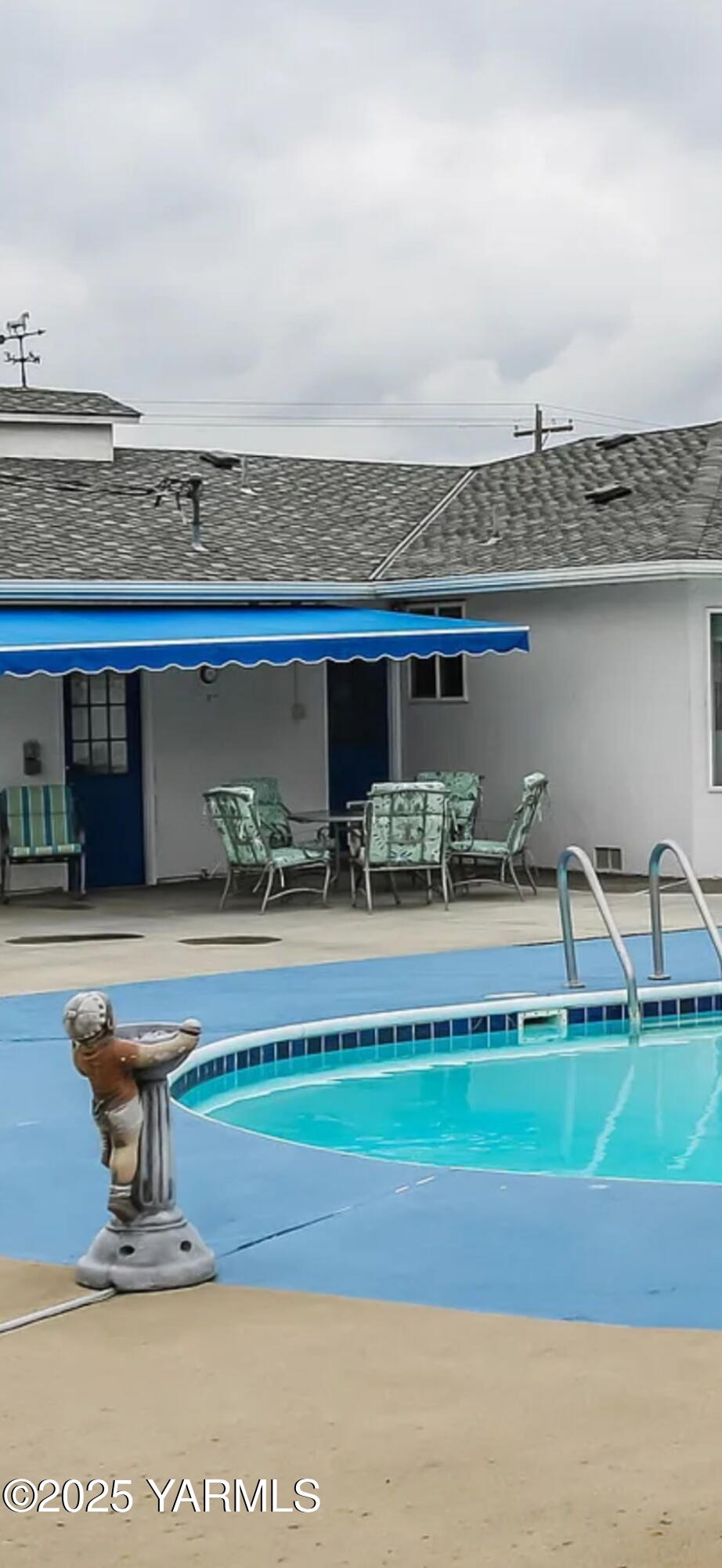 5503 Norman Road Yakima, WA 98901 - Photo 33 of 35 a view of a swimming pool with outdoor seating and plants