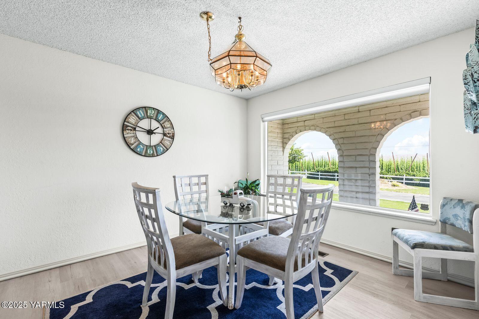 5503 Norman Road Yakima, WA 98901 - Photo 8 of 35 a view of a dining room with furniture window and outside view