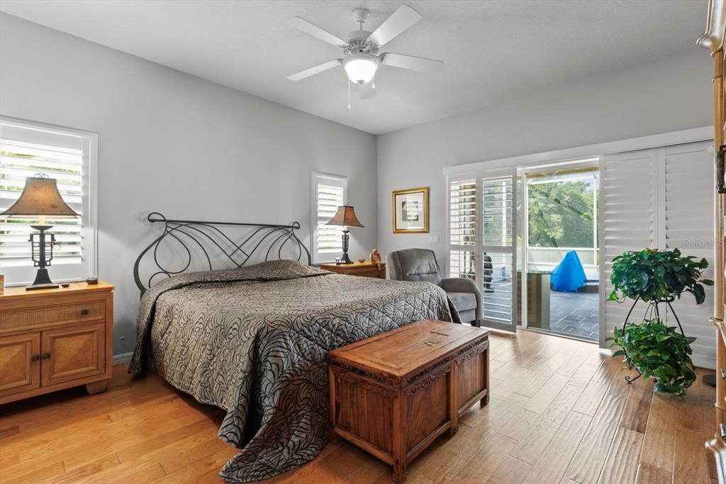 1802 North Musial Point Hernando, FL 34442 - Photo 17 of 42 a bedroom with a bed and large windows