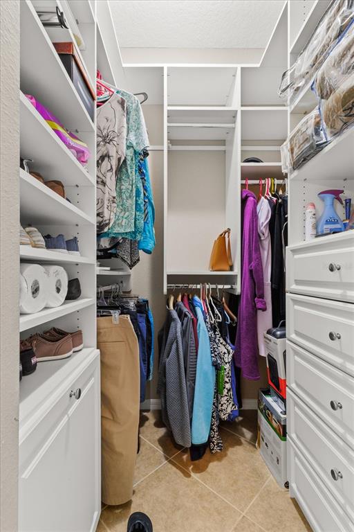 1802 North Musial Point Hernando, FL 34442 - Photo 18 of 42 a view of walk in closet with clothes and shoes