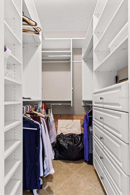 1802 North Musial Point Hernando, FL 34442 - Photo 19 of 42 a view of walk in closet with clothes and shoes