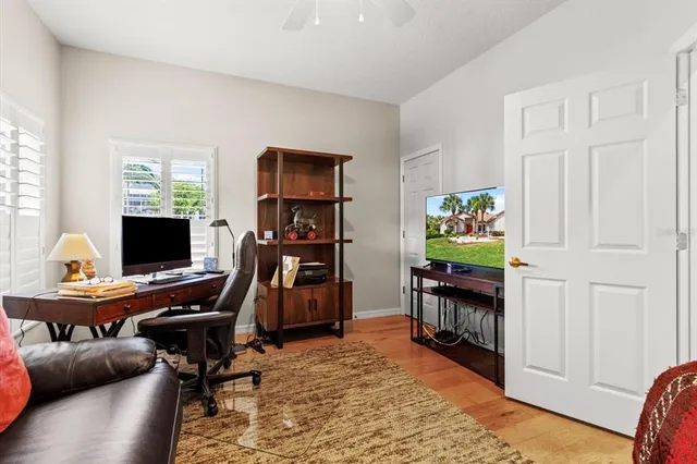 a bathroom with a granite countertop sink a toilet and a mirror