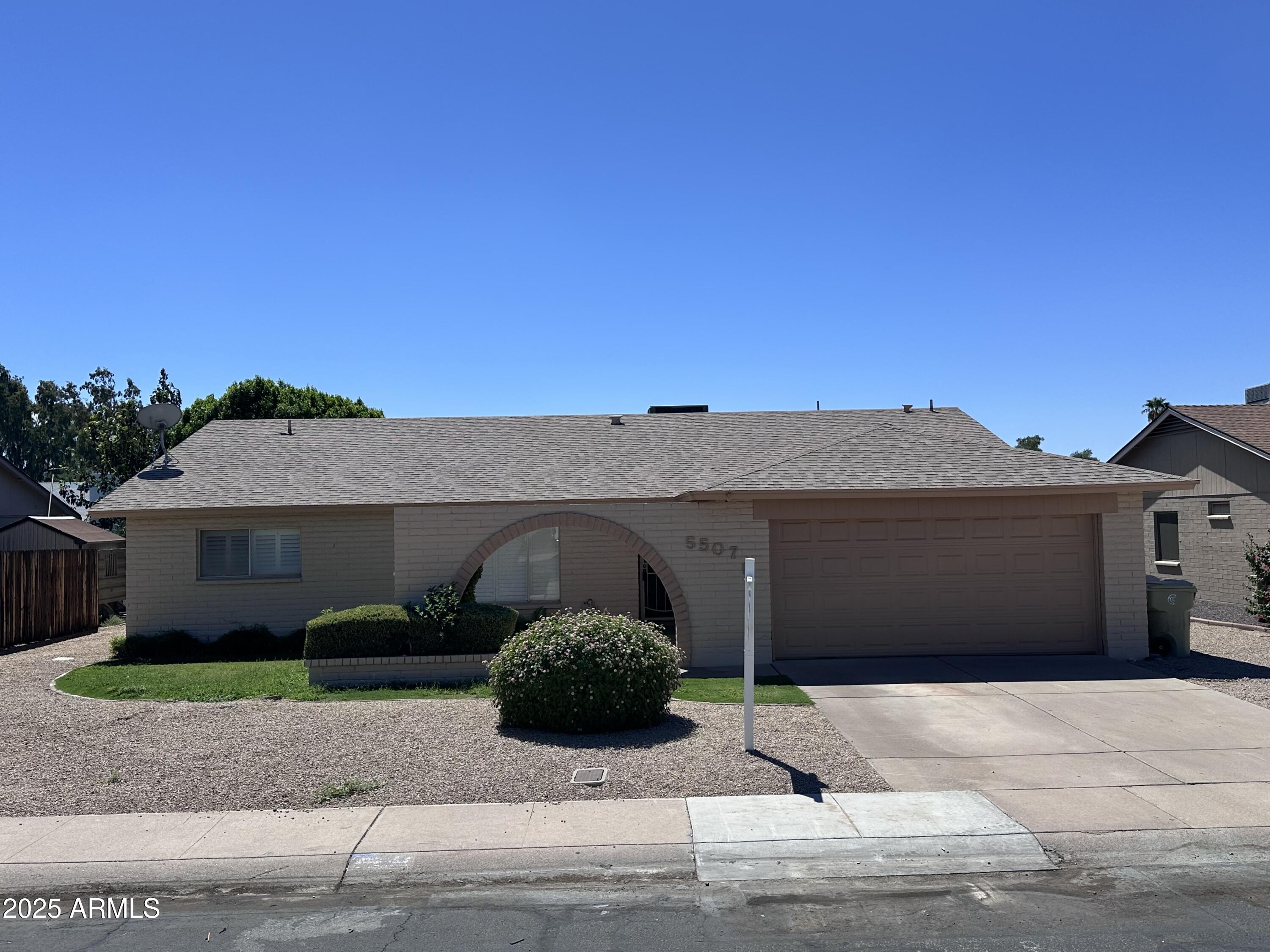 a front view of a house with a garage