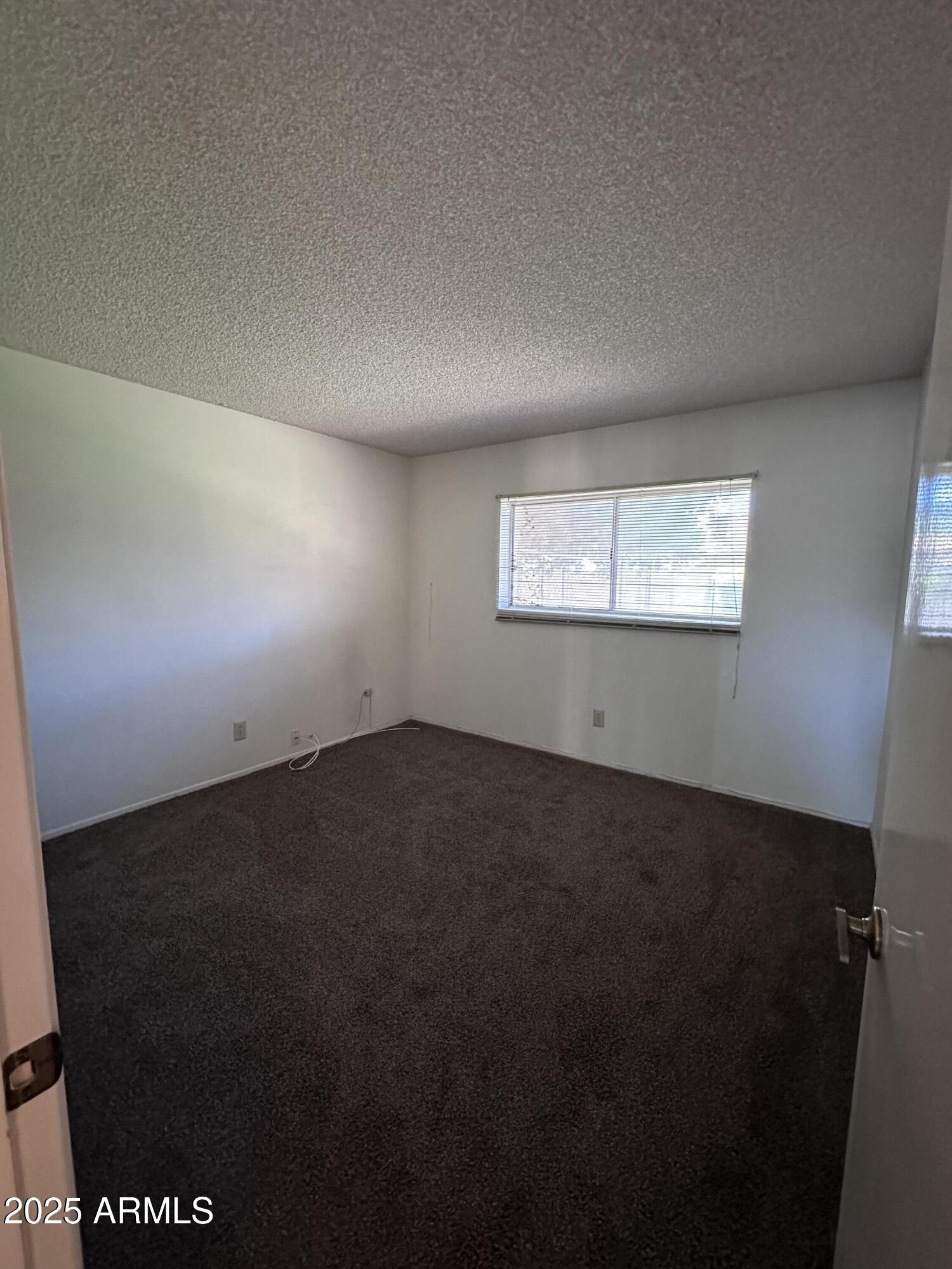 5507 West Hearn Road Glendale, AZ 85306 - Photo 15 of 19 a view of an empty room and window