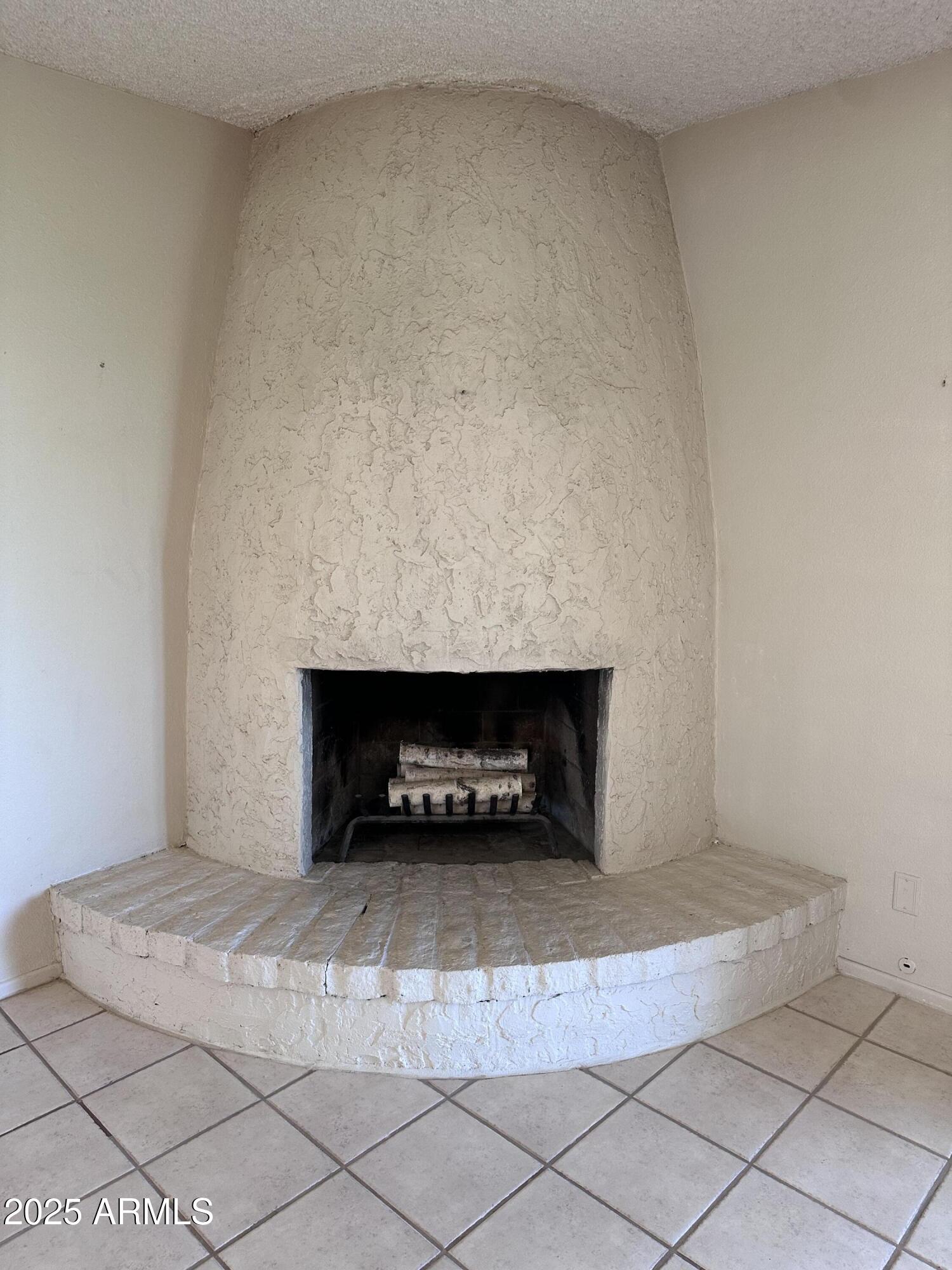5507 West Hearn Road Glendale, AZ 85306 - Photo 17 of 19 a room with a fireplace