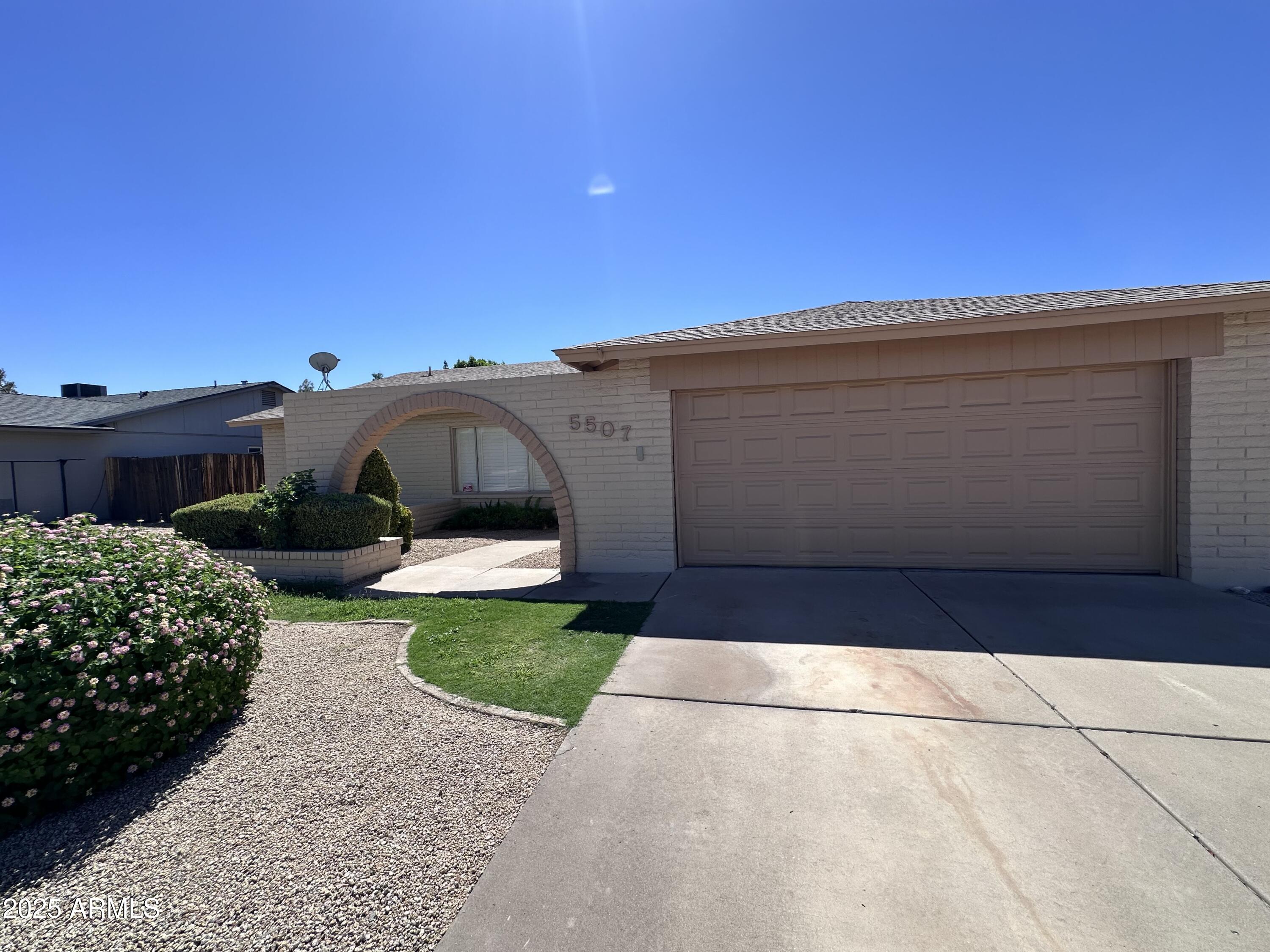 5507 West Hearn Road Glendale, AZ 85306 - Photo 2 of 19 a view of a back yard of the house