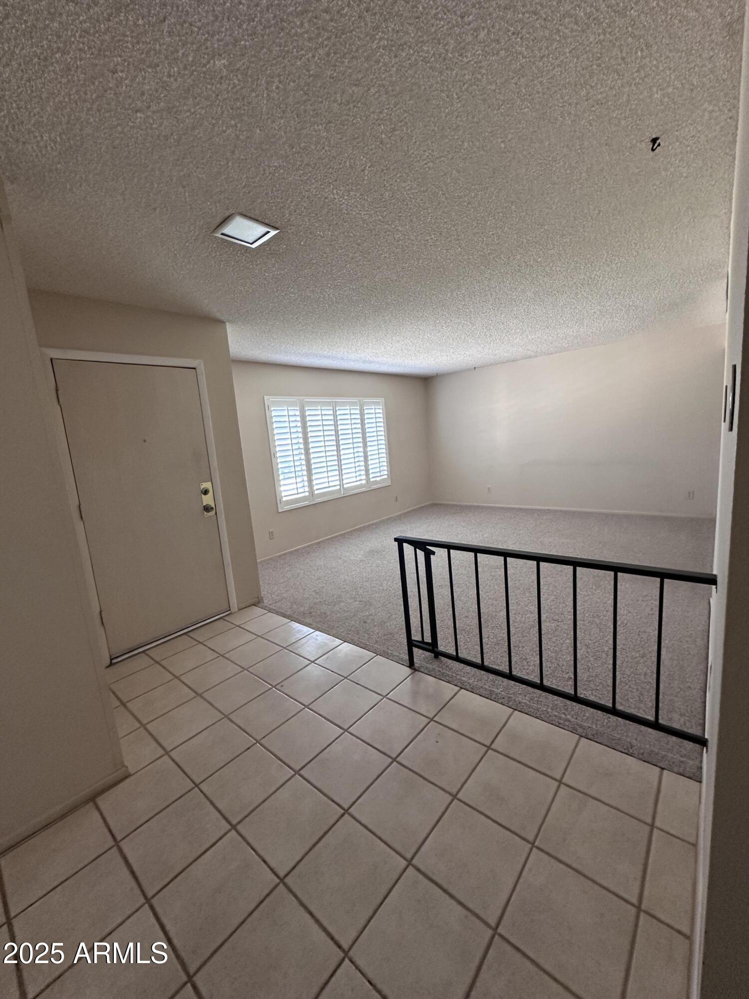 5507 West Hearn Road Glendale, AZ 85306 - Photo 4 of 19 a view of staircase with white walls